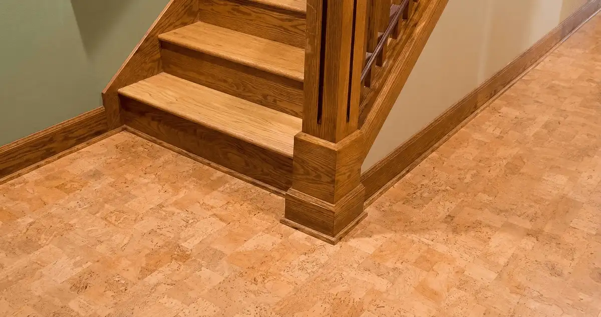 End of a staircase with cork flooring in Worcester, MA
