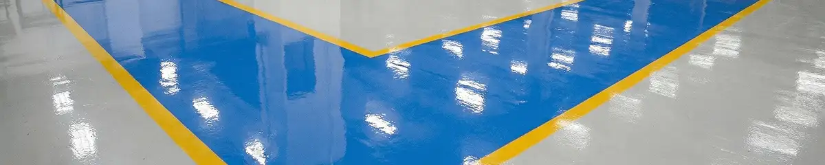A factory floor professionally covered and marked with epoxy flooring in Worcester, MA