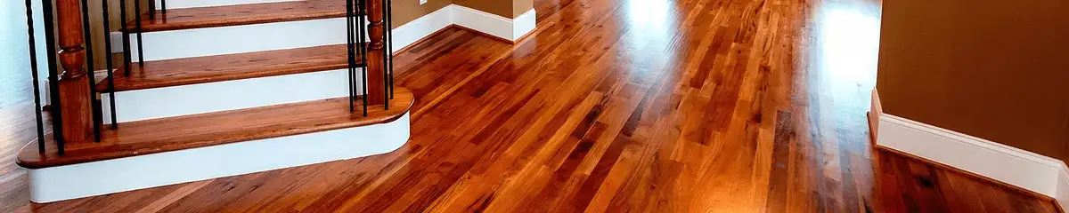 Base floor of a staircase with professionally restored wood flooring in Worcester MA
