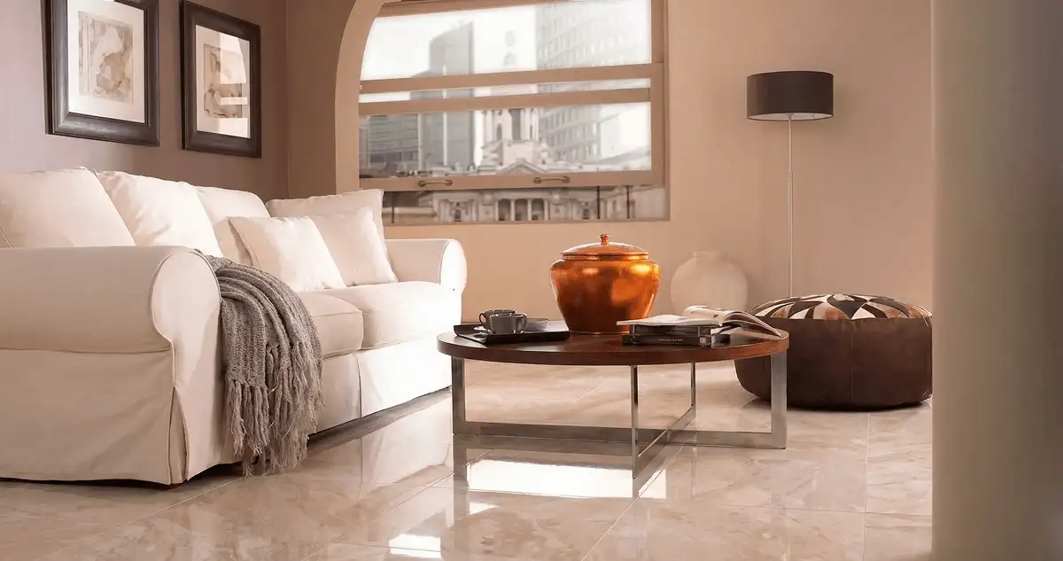 Modern living room with professionally installed marble flooring, a beige sofa, coffee table in Worcester, MA