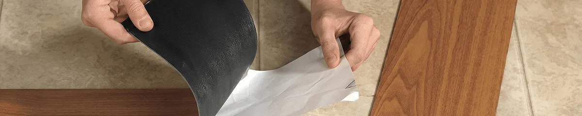 A professional installing vinyl flooring in Worcester, MA