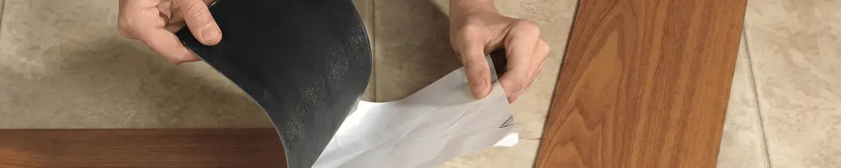 A professional installing vinyl flooring in Worcester, MA
